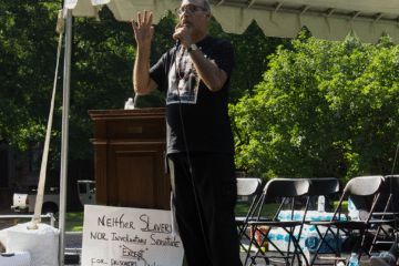 Max Parthas of New Abolitionists Radio delivers a speech at the Millions For Prisoners Human Rights March in Washington, D.C. on August 19, 2017.