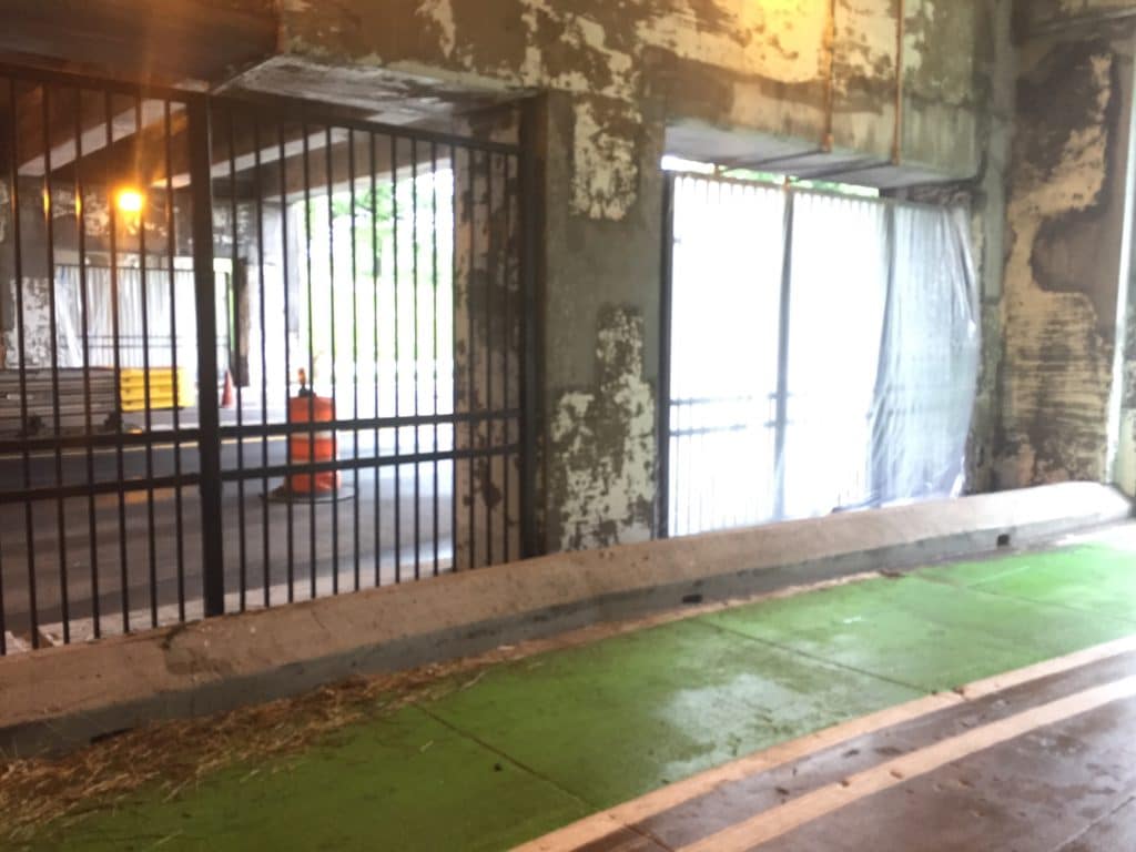 The fencing and bicycle path on the sidewalk is defensive architecture put in after the homeless were evicted in September 2017. (Photo: Kevin Gosztola)