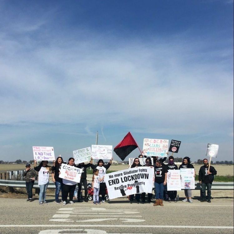 Families gather outside the state prison in Corcoran, California, to protest prisoner fights and lockdown conditions. (Credit: IWOC)