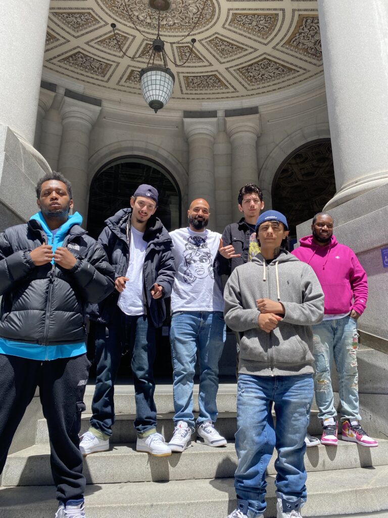 Devon Adams and Matt Murphy (also formerly incarcerated at WSR) pose with other Seattle-based youth at a trauma retreat in San Francisco. (Credit: Devon Adams)